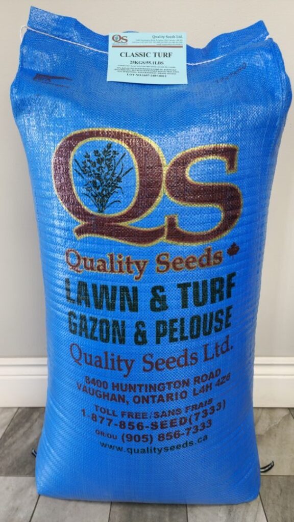 A blue bag from Quality Seeds Ltd. labeled "LAWN & TURF" with company details and address in Vaughan, Ontario, placed on a tiled floor.